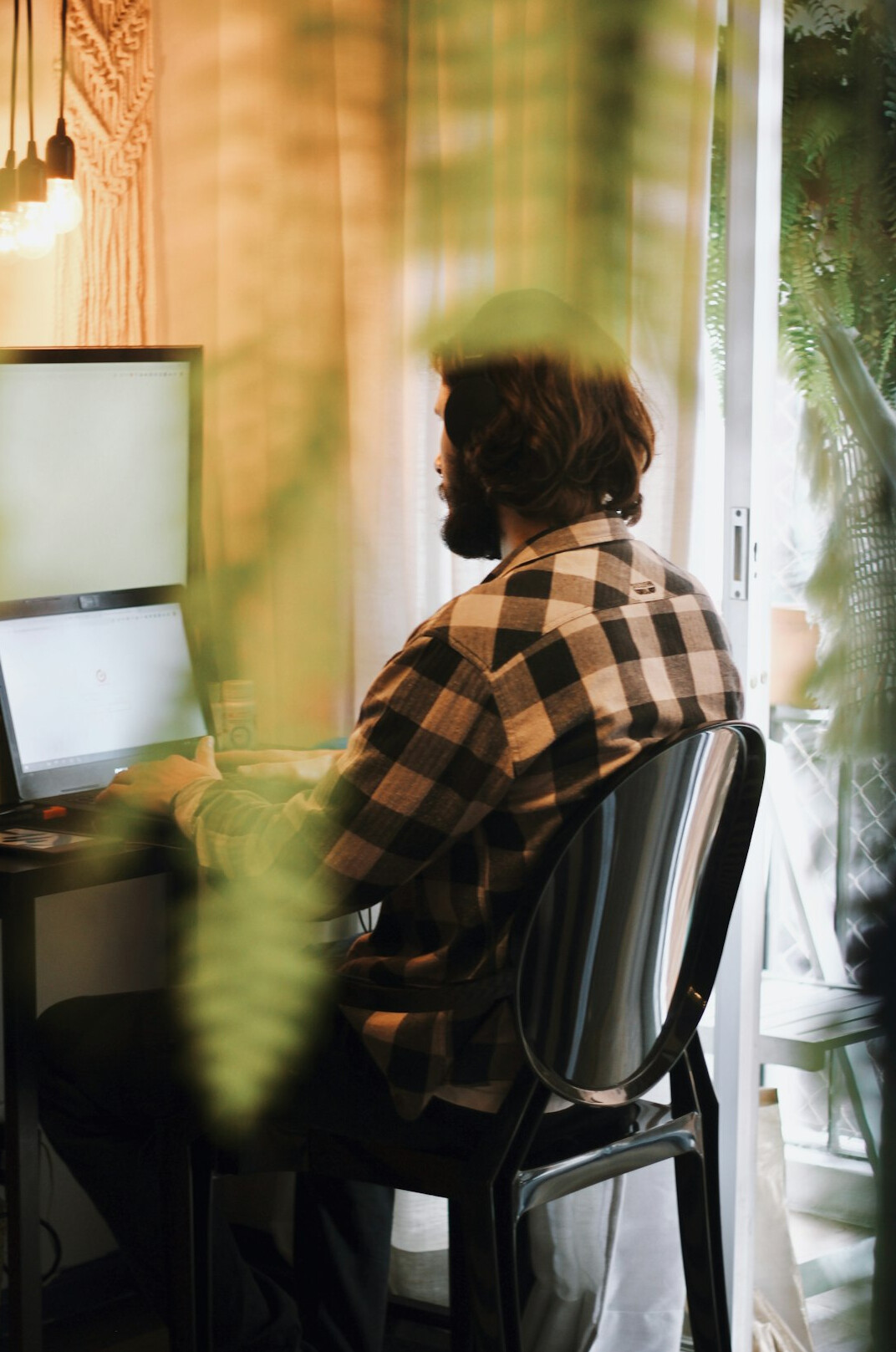 person coding on laptop at home