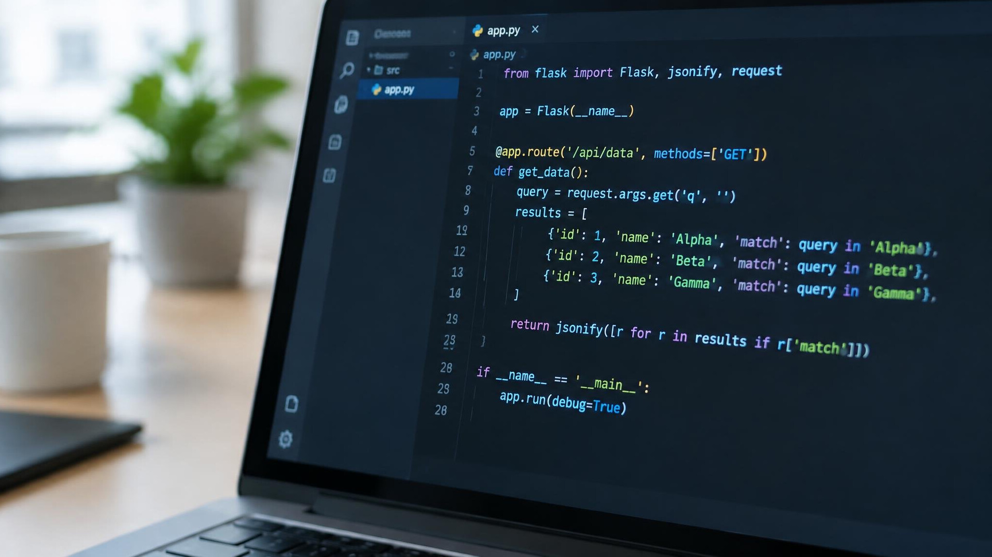 Close-up of a laptop screen showing colorful programming code